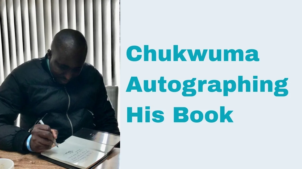 Chukwuma Autographing His Book 1